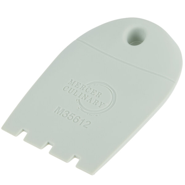 A white plastic spatula with a square notch on the end.