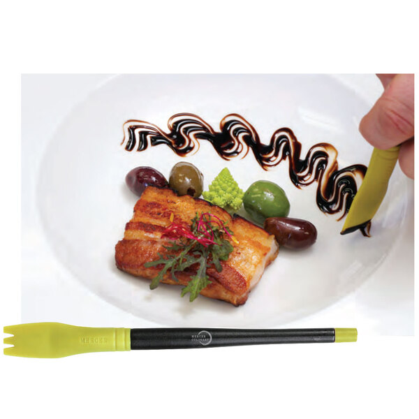 A person using the Mercer Culinary silicone brush to plate food.