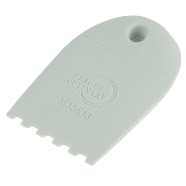 A white plastic spatula with a square notch at the end.