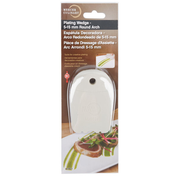 A white Mercer Culinary round silicone plating tool on a white surface.