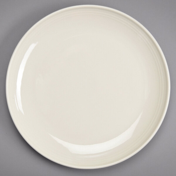 A Homer Laughlin ivory round plate with a rim.