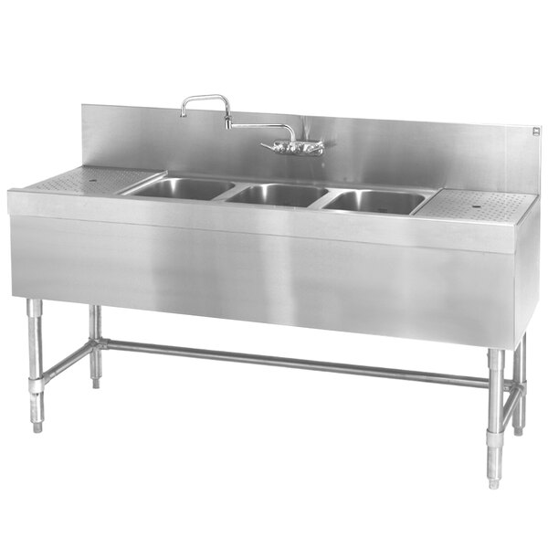 A close up of an Eagle Group stainless steel underbar sink with three bowls and a drainboard.