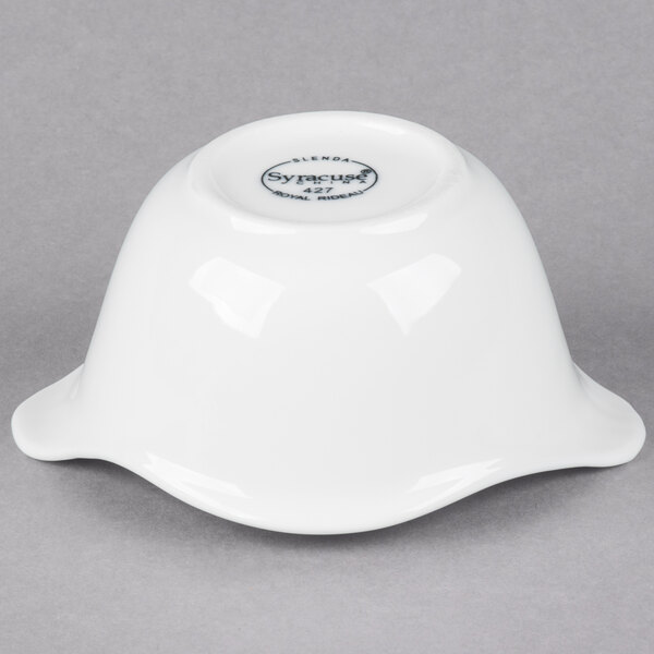 A white Libbey porcelain bowl with fluted edges and a Royal Rideau black logo.