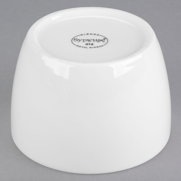 A white porcelain Libbey bouillon bowl with a lid on it.