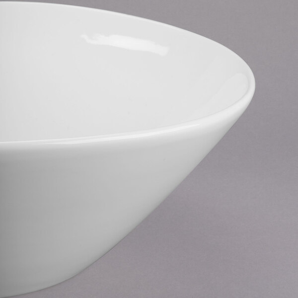 A close-up of a Libbey Royal Rideau white porcelain bowl with a small rim.