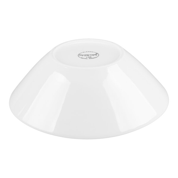 A white porcelain bowl shown upside down on a white background.