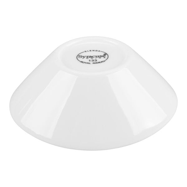 A white porcelain bowl shown upside down with a circular mark and text on the base.