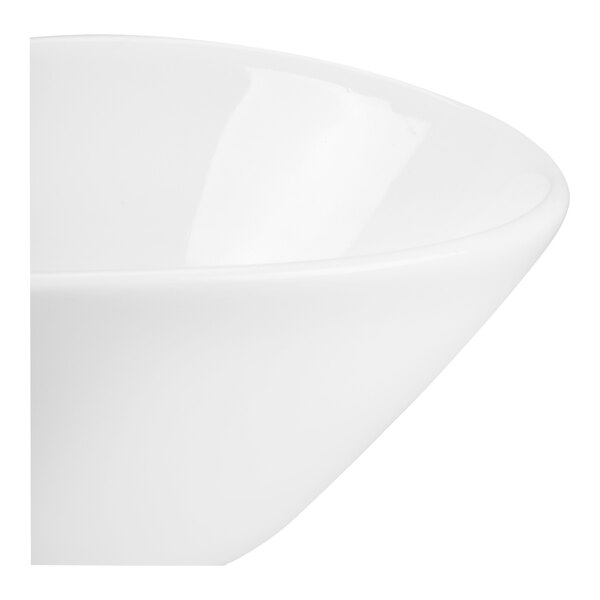 A close-up view of a smooth, white, glossy bowl with a rounded edge.