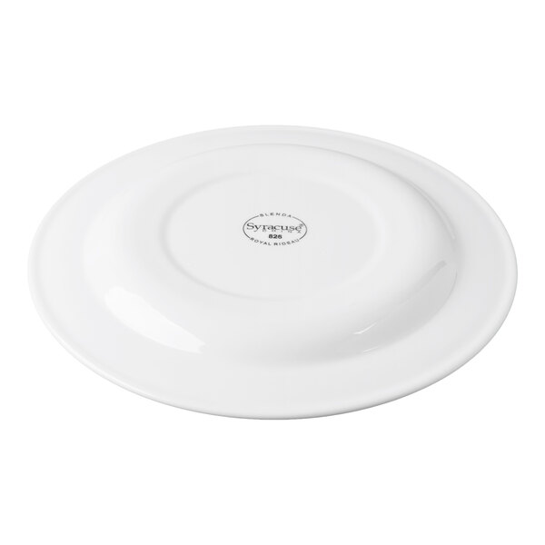 A white round porcelain plate with a medium rim, shown upside down.