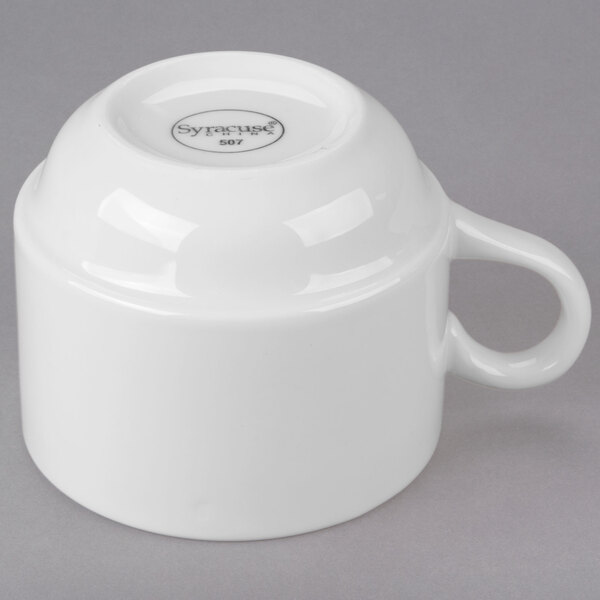 A white Libbey Royal Rideau porcelain tea cup with a handle.