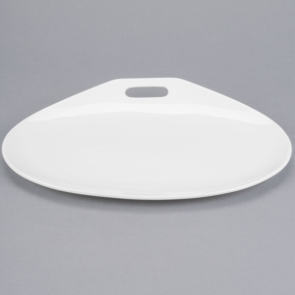 A white oval Libbey porcelain plate.