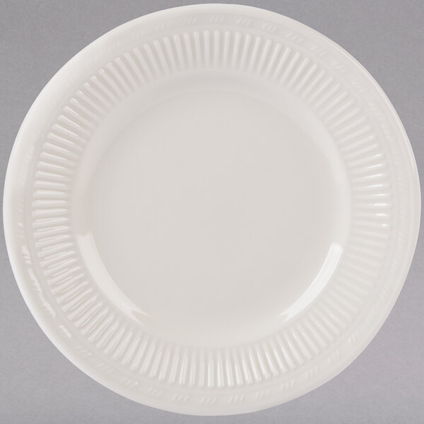 A Tuxton eggshell embossed china bread and butter plate with a pattern on it.