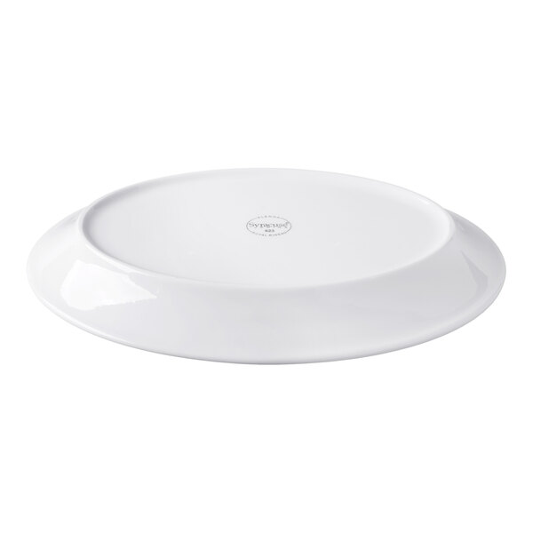 A white, oval-shaped porcelain platter shown upside down with a slightly raised foot.