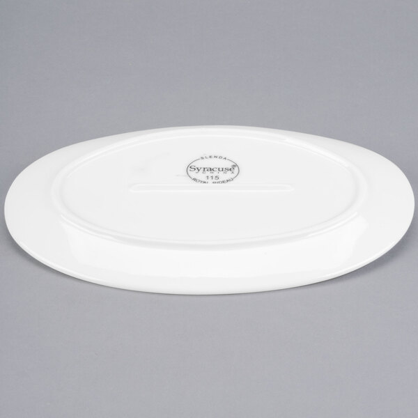 A white Libbey porcelain oval plate with a logo on it.