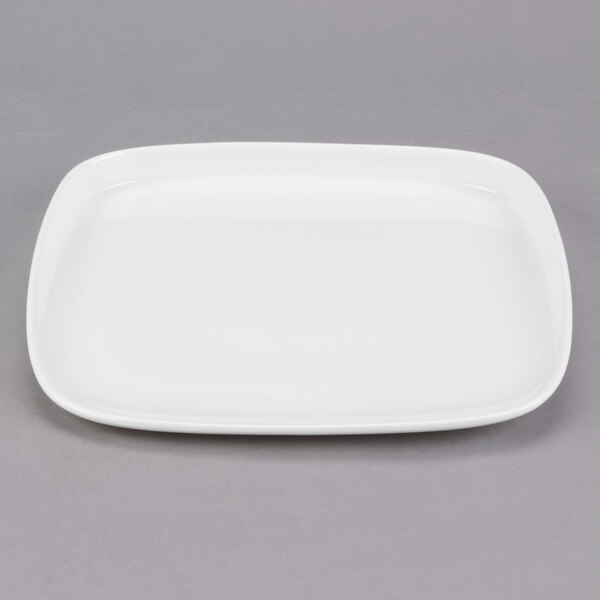 A white Libbey square porcelain plate with a small rim.
