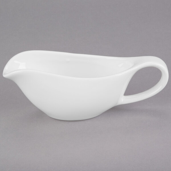 A white Libbey Royal Rideau porcelain sauce boat.