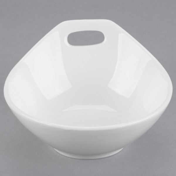 A white Libbey porcelain bowl with a handle.