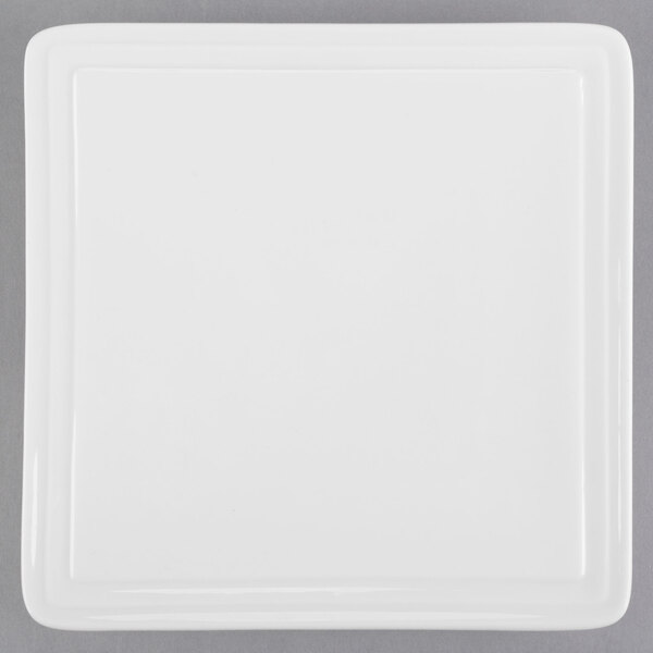A white Libbey square porcelain plate.