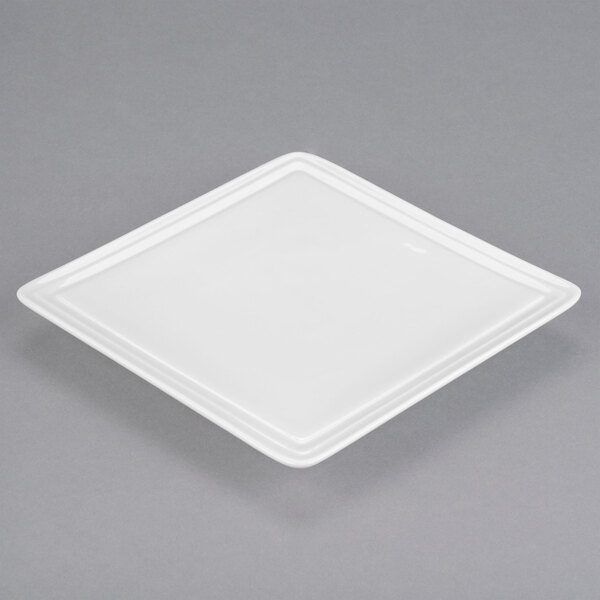 A white Libbey square porcelain plate.