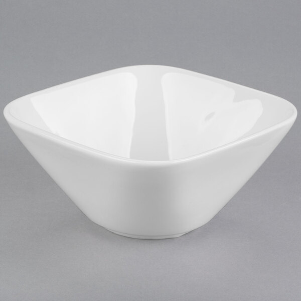 A close up of a white square Libbey Royal Rideau porcelain bowl.