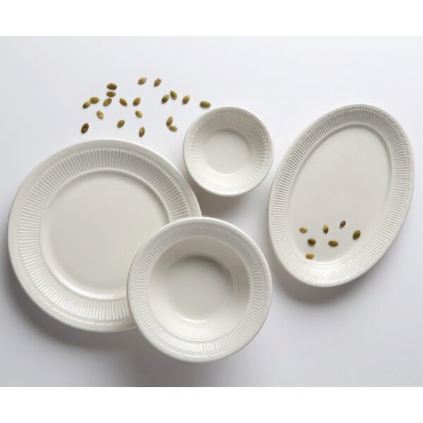 A group of Tuxton Hampshire eggshell embossed china fruit dishes with seeds on them.