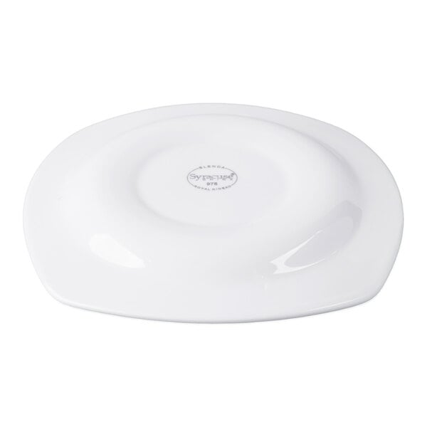 A white, square-shaped porcelain plate shown upside down with a manufacturer's mark in the center.