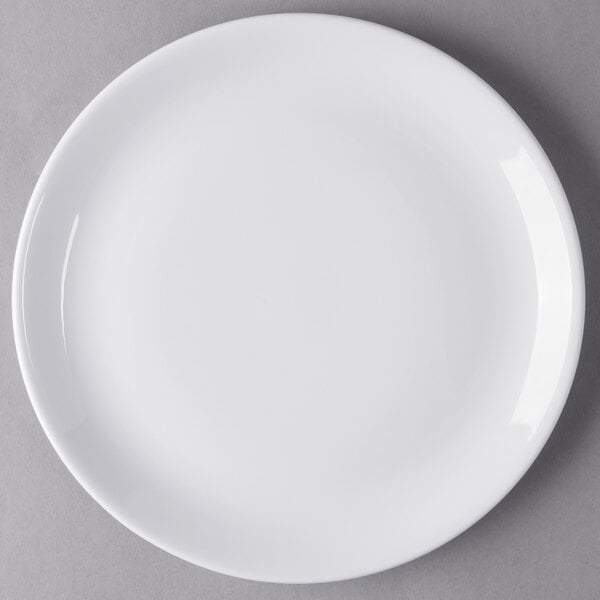 A Libbey white porcelain coupe plate with a white rim.