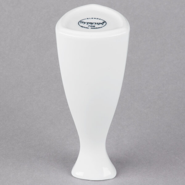 A close-up of a white Libbey porcelain sake bottle with a black lid.