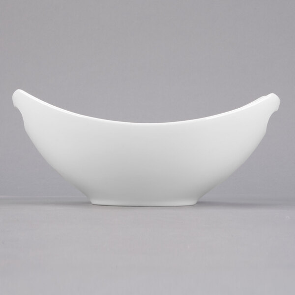 A close-up of a Libbey white porcelain bowl with handles.