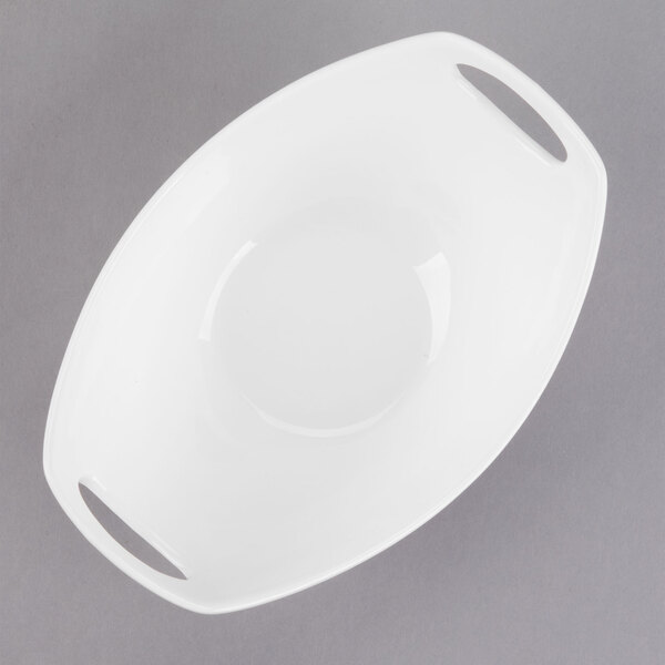 A white Libbey porcelain bowl with two handles.