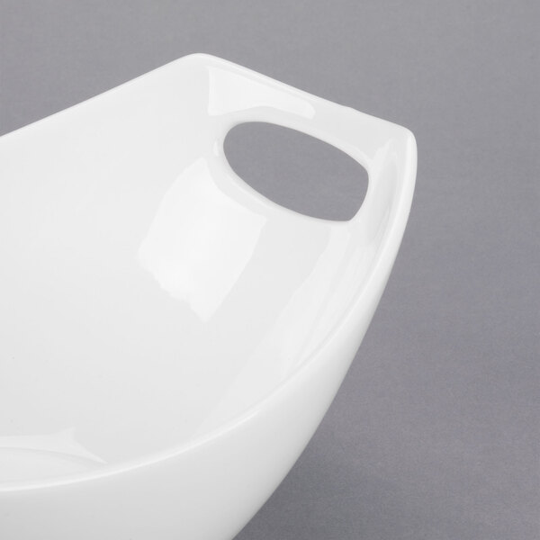 A white Libbey porcelain bowl with handles.