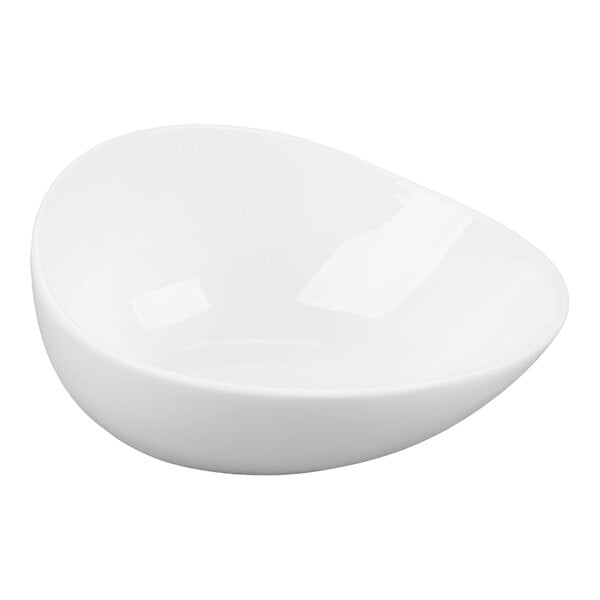 A white, asymmetrical porcelain bowl with smooth, rounded edges.