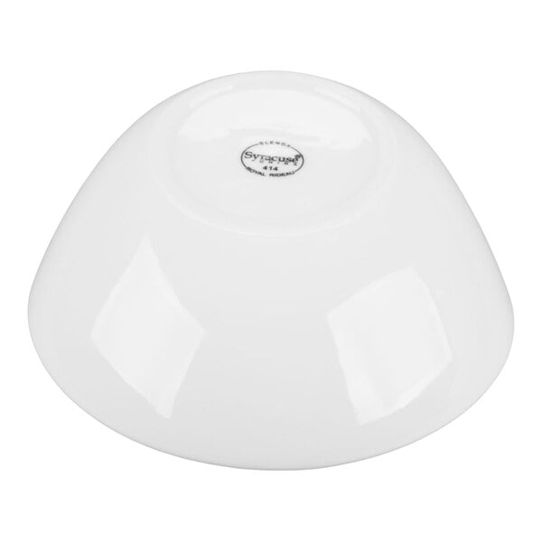 A white porcelain bowl shown upside down with a small circular logo on the bottom.