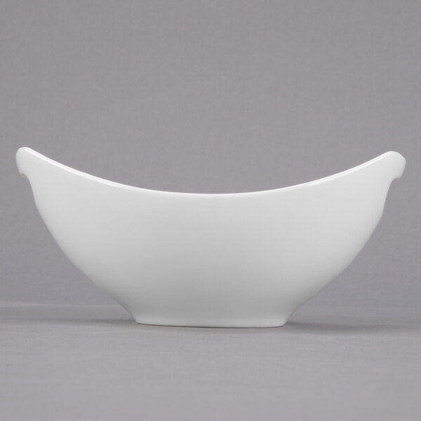 A close-up of a Libbey Royal Rideau white porcelain bowl with handles.
