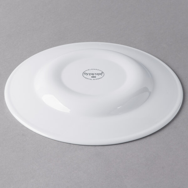 A white Libbey porcelain plate with a circular design on the rim.