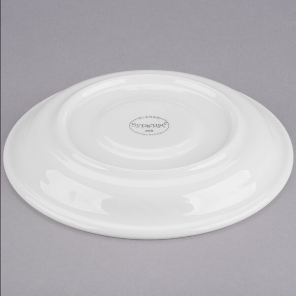 A white Libbey Royal Rideau tea saucer with a logo on it.