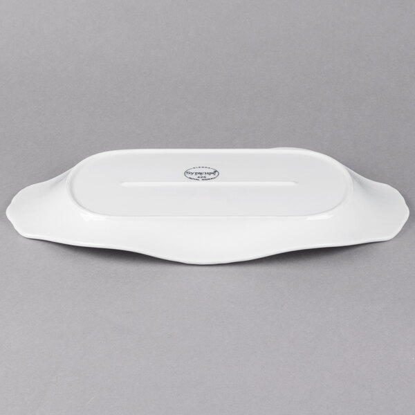 A white rectangular porcelain platter with a handle.