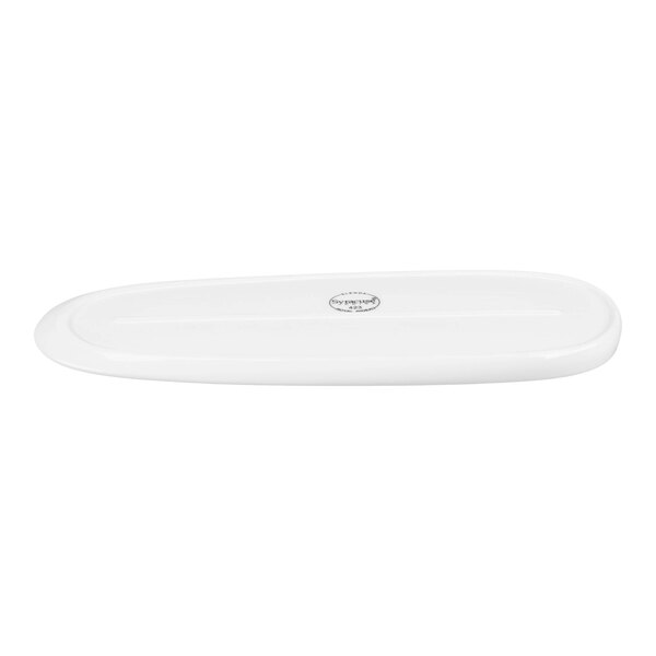A white, oval-shaped porcelain tray with a smooth surface and a small circular logo in the center.
