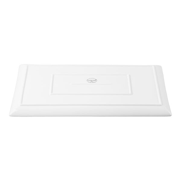 A rectangular white porcelain tray with a slightly raised border and a smooth surface.