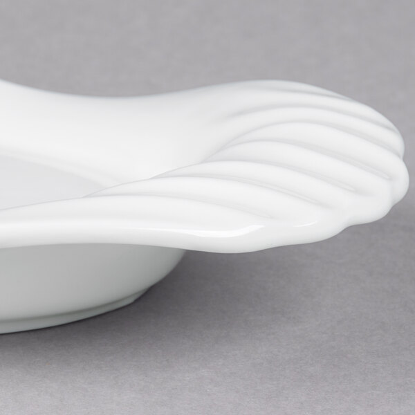 A white porcelain tray with curved edges.