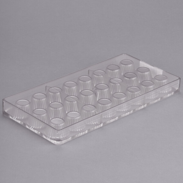 A clear plastic tray with small cups.
