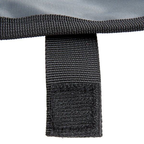 A Mercer Culinary 7 piece plating spoon set in a black and gray bag with a black strap.