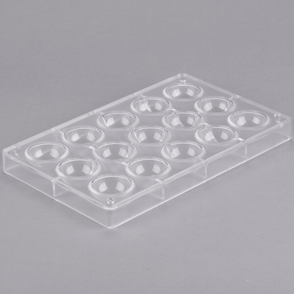 A clear plastic tray with 15 half sphere holes.