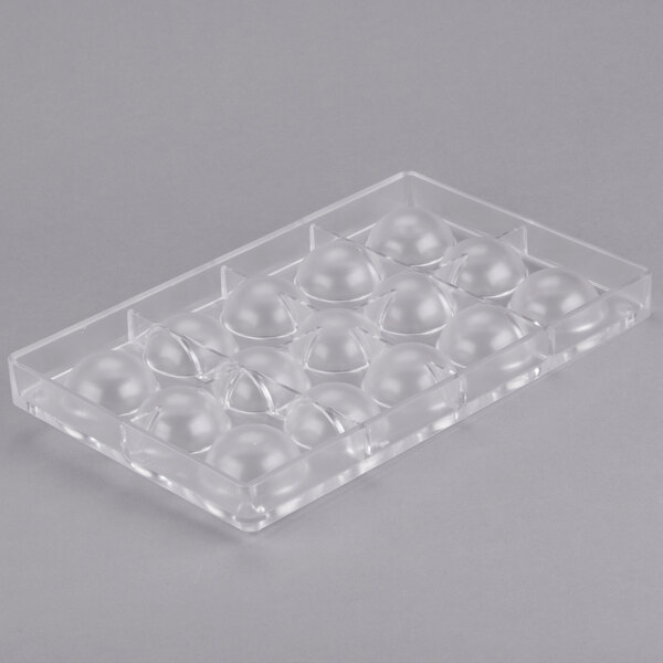 A clear plastic container with round balls.