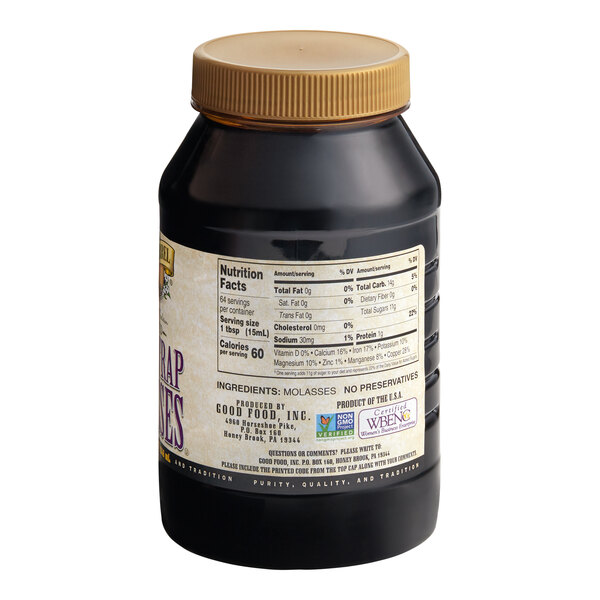 A plastic container of Golden Barrel Blackstrap Molasses with a label.