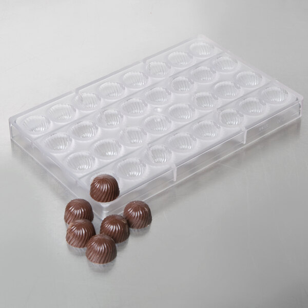 A Chocolate World plastic tray with 32 rose-shaped chocolate candies.