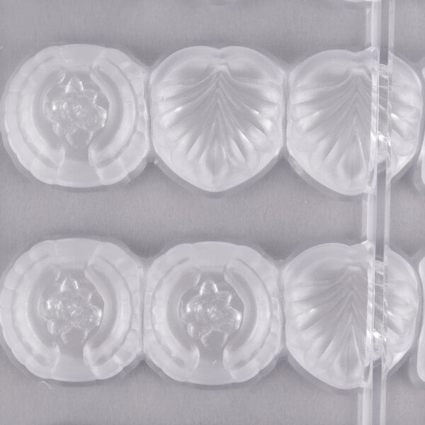 A white Matfer Bourgeat plastic chocolate mold tray with 36 compartments.