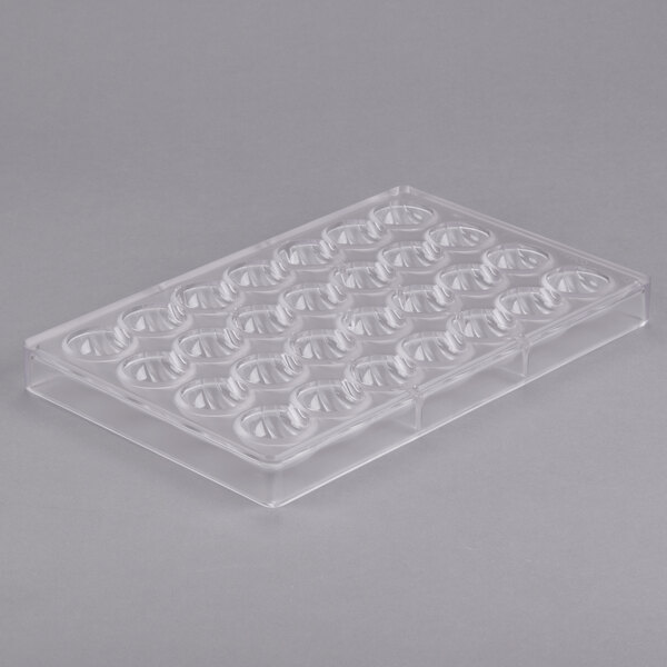 A clear plastic Matfer Bourgeat chocolate mold tray with half circle holes.