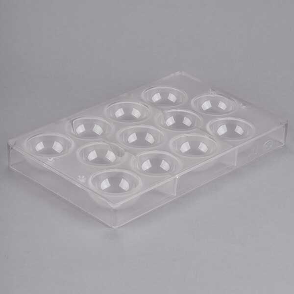 A clear polycarbonate tray with 12 half sphere compartments.