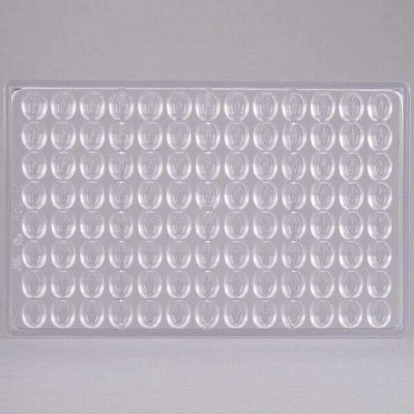 A clear plastic tray with many ovals.